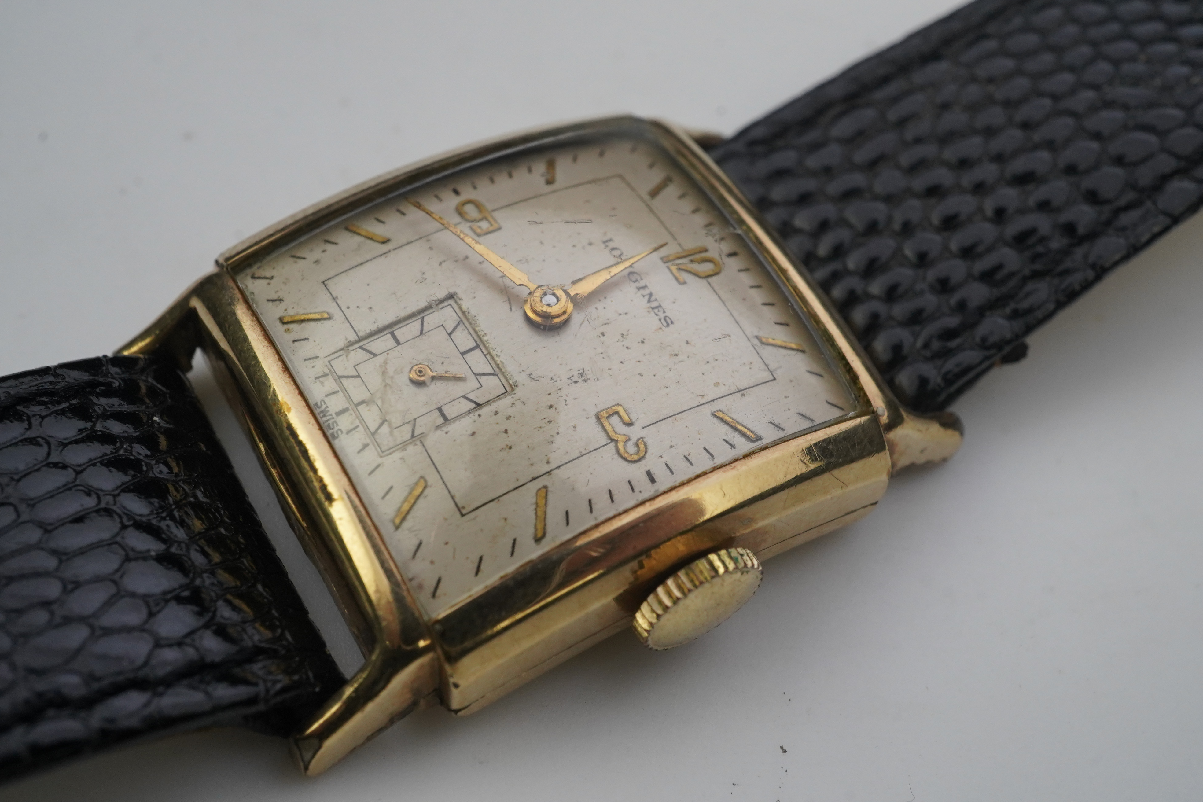 A gentleman's late 1940's gold plated Longines manual wind wrist watch, on a later associated leather strap